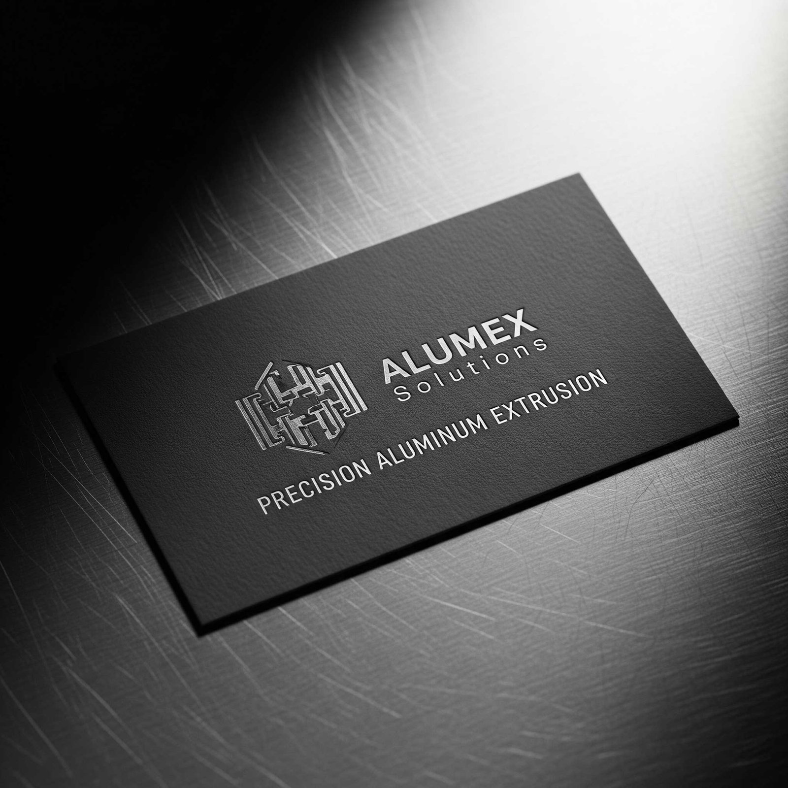 Professional custom business card for an aluminium profile business, placed on a metal background.